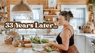 A woman in a kitchen setting with the text overlay '33 Years Later.